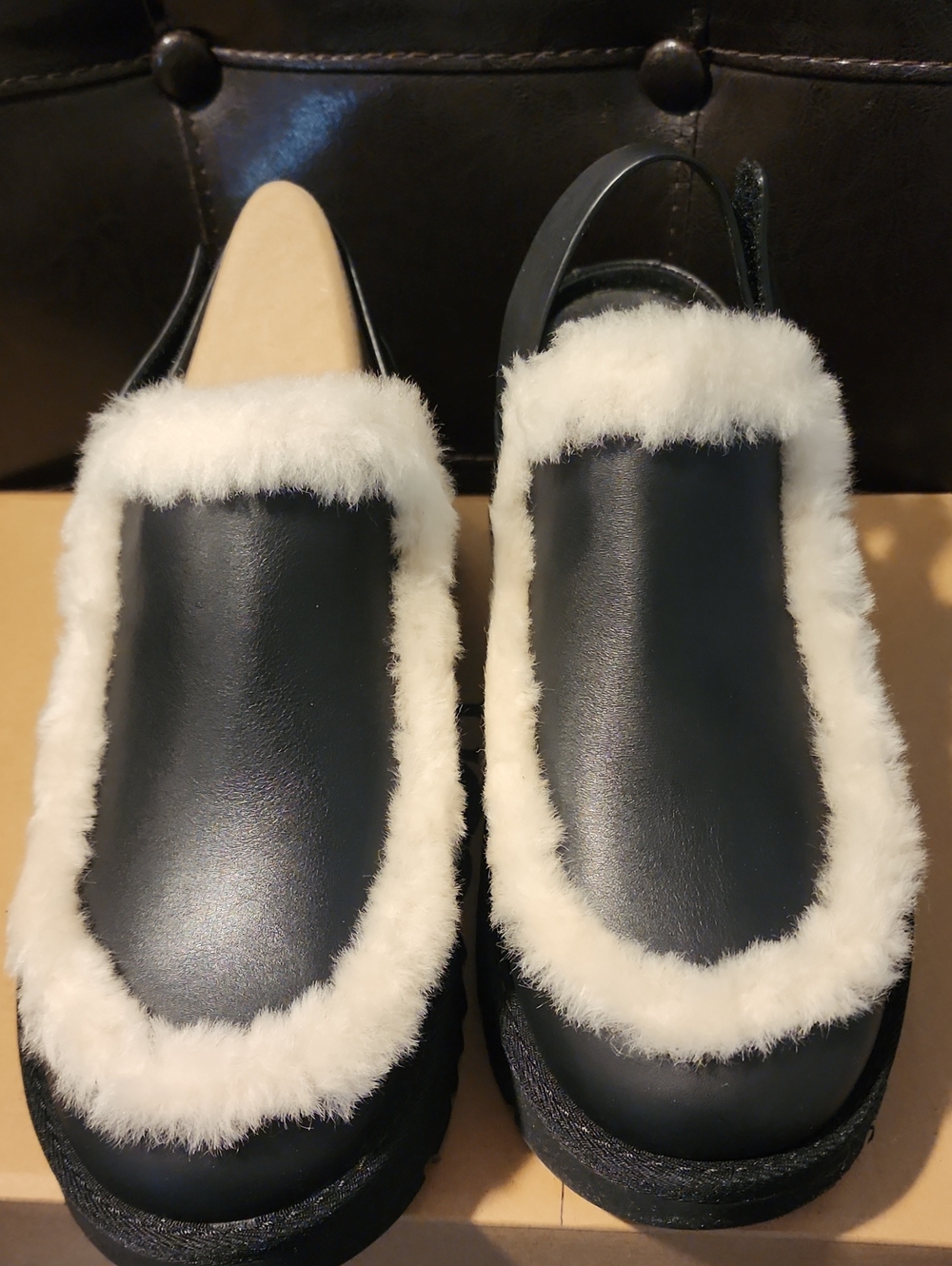 UGG Black Leather Clog with Cream Shearling Trim